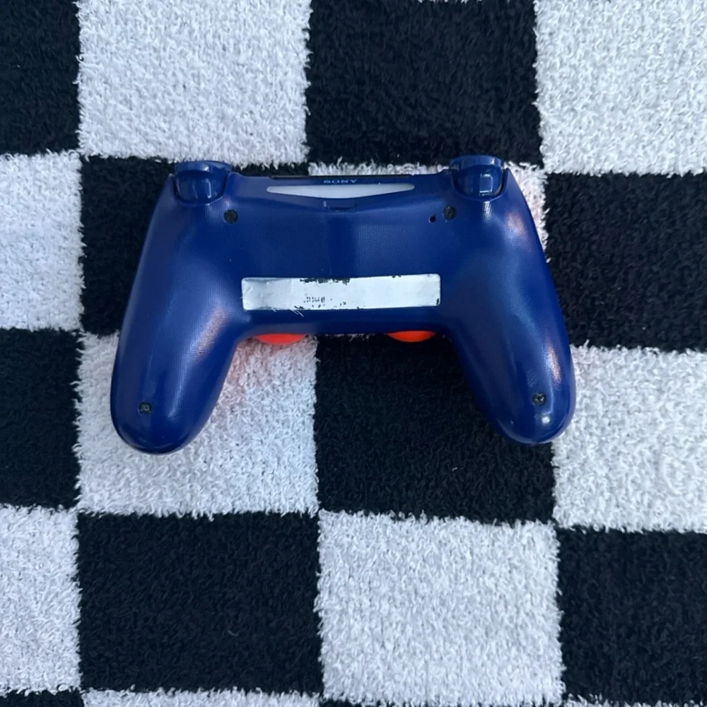 Sony PS4 Console - Black Comes with a Orange and Navy blue controller.